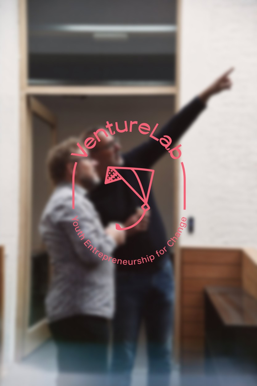 man walking in front of textured wall