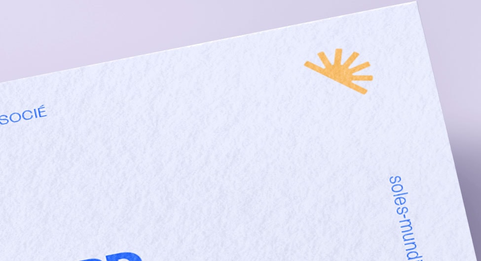 two people sitting on a ledge talking